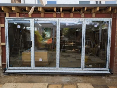 White aluminium Bifold doors design by Durajoin