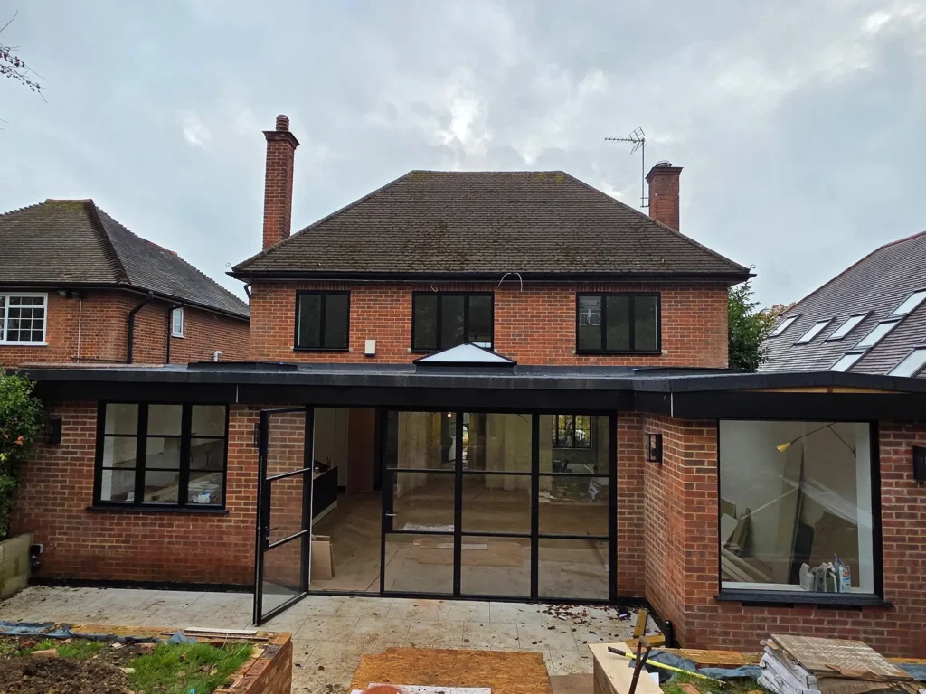 Aluminium bifold doors opening to garden in London home