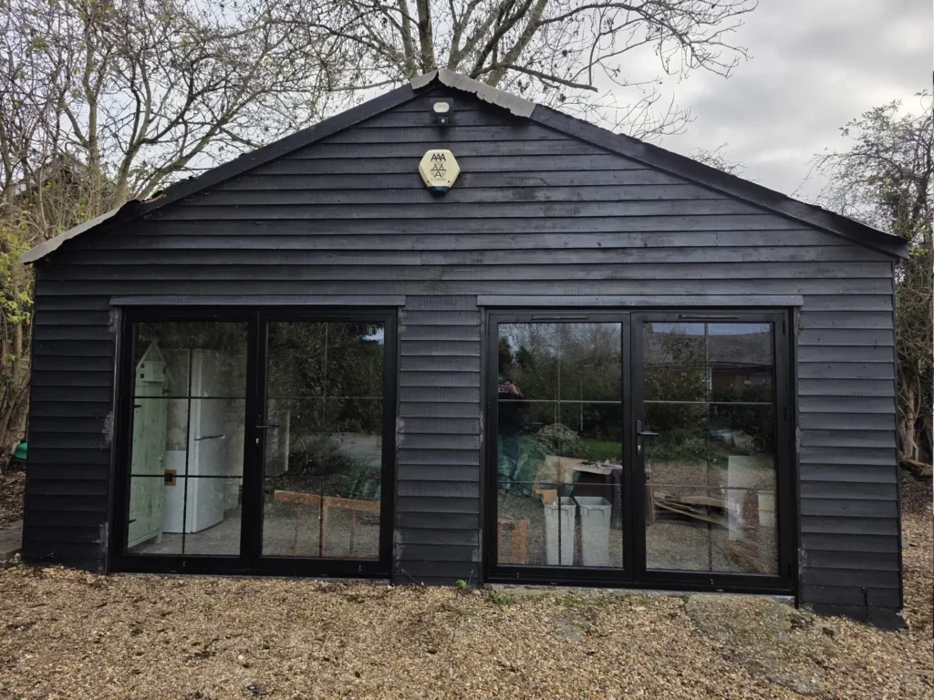 Black bifold doors installed by Durajoin