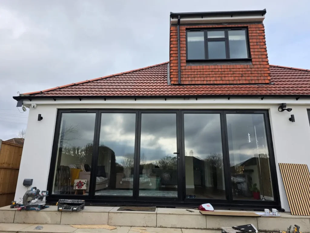 Bespoke black aluminium bifold doors professionally installed in London