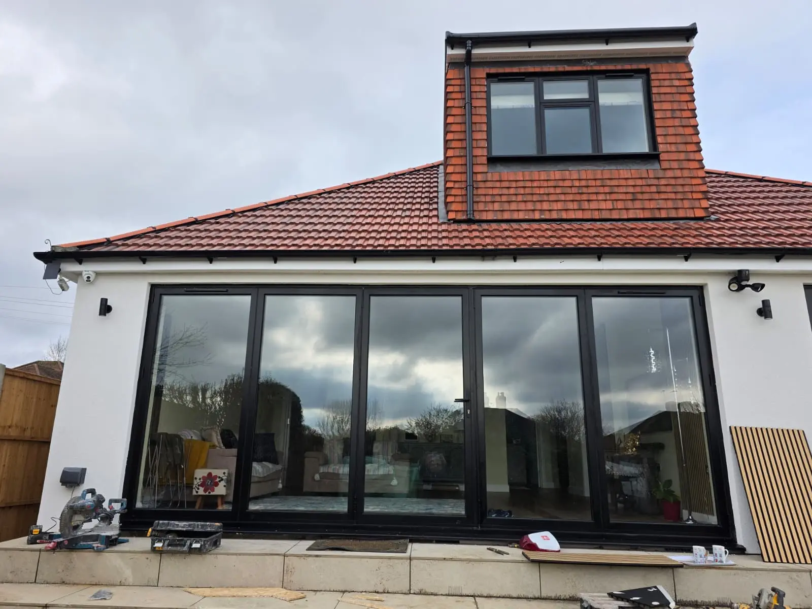 Bespoke black slimline aluminium bifold doors in London supply and installed by Durajoin