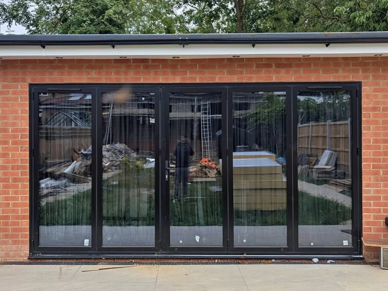 Aluminium bifold doors installed in Wesminster property by Durajoin